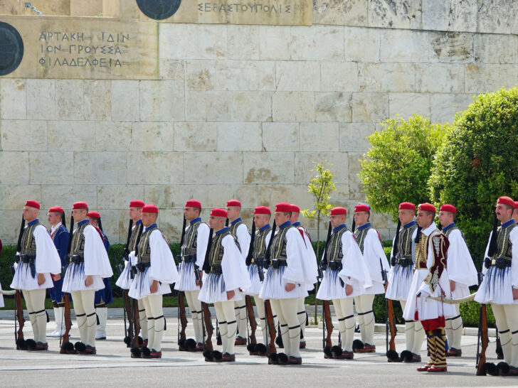 Guards, in their white ceremonial uniforms, at the Sunday morning changing of the guard ceremony in Athens Greece.