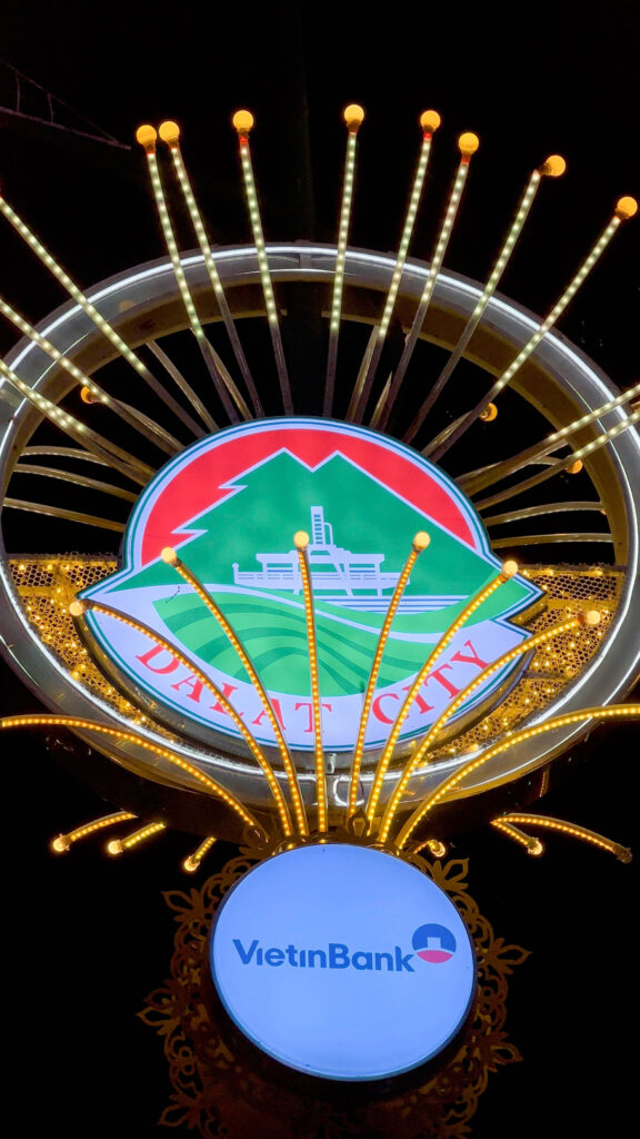 A moving light sign welcoming visitors to Dalat.