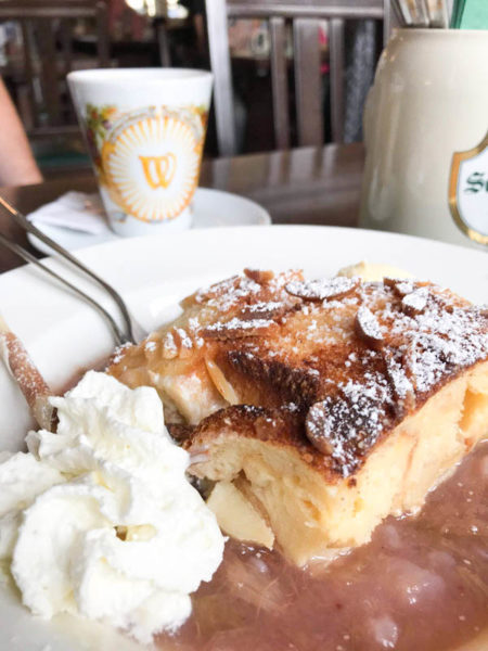 Not sure what to eat in Germany? Try a German dessert of bread pudding and whipped cream.