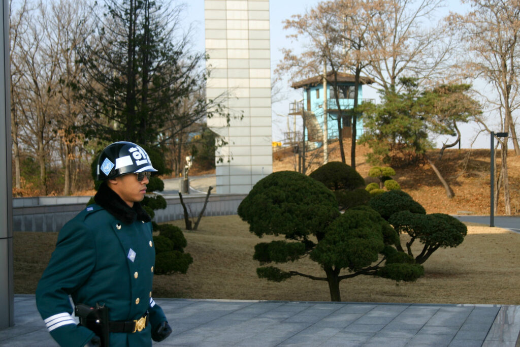 A South Korean soldier with his intimidating stance to warn the North Koreans to stay back stands along the Demilitarized Zone.