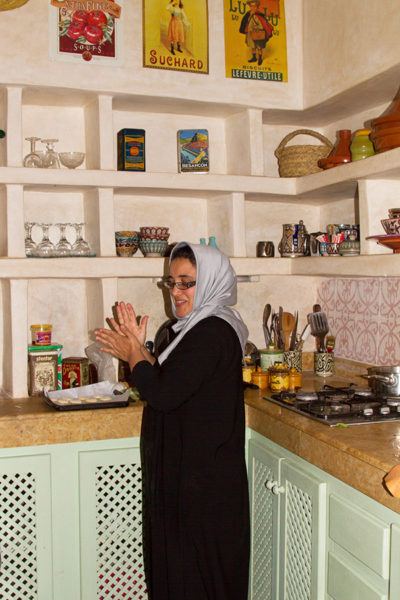 Our host at Dar Dayana prepares our breakfast in her spotless, well-organized kitchen.