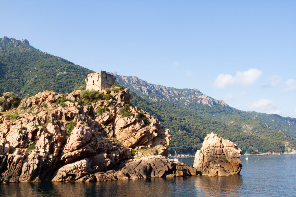A timeless Genoan tower sits above the port of Porto Ota where you can a boat tour to the Scandola Nature Reserve.