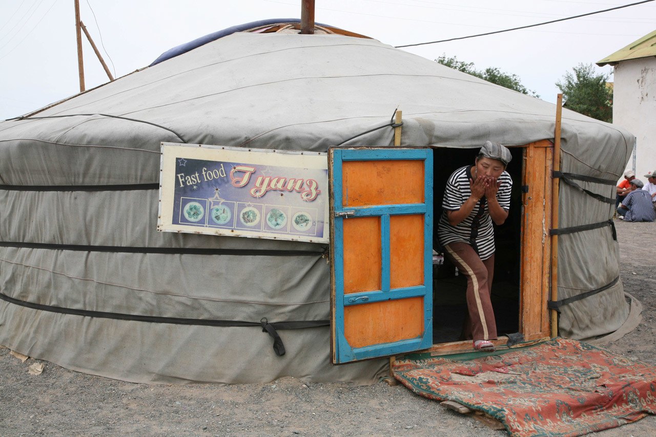 Khuushuur Restaurant, with satisfied customer exiting.