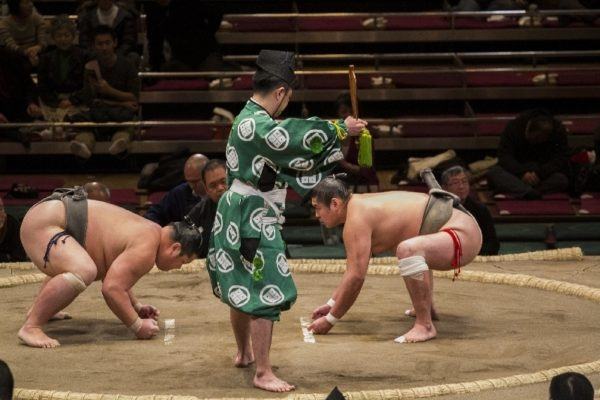 The referee starts the match.