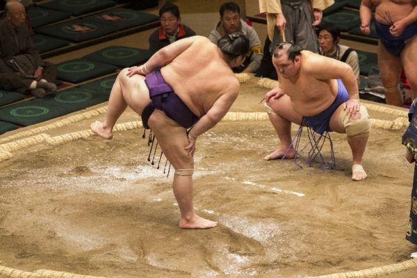 The wrestlers perform the pre-bout ritual.