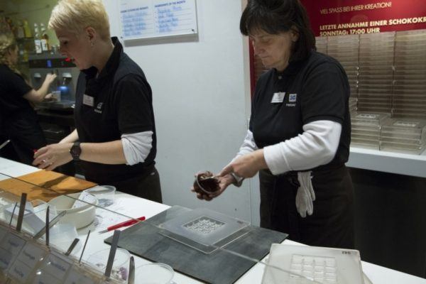 Mixing your special ingredients into the rich chocolate.