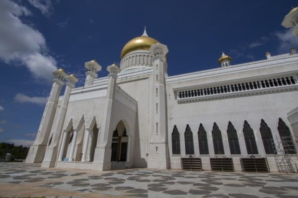 Golden domes and stylish minarets adorn the Omar Ali Saifuddin Mosque.