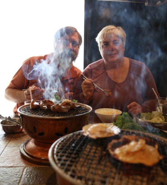 Jim and me at a grill restaurant with Scallops on the grill along with all kinds of Japanese delicacies that we added to this Japan food guide. 
