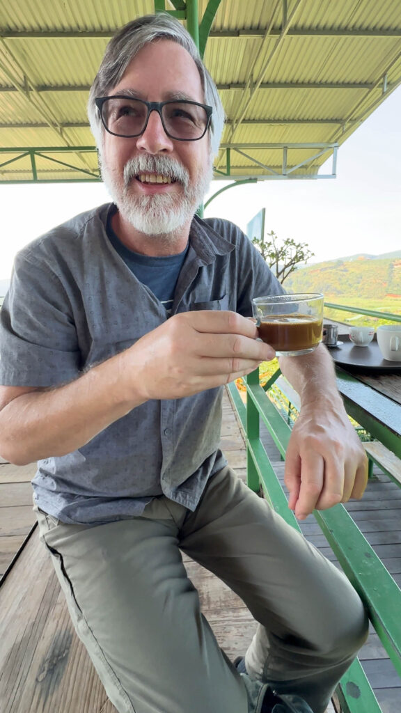 Jim trying weasel poop coffee in Vietnam.