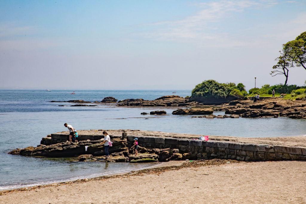 Families enjoy tide-pooling during the summer, like here at Kannonzaki Park in Yokosuka.