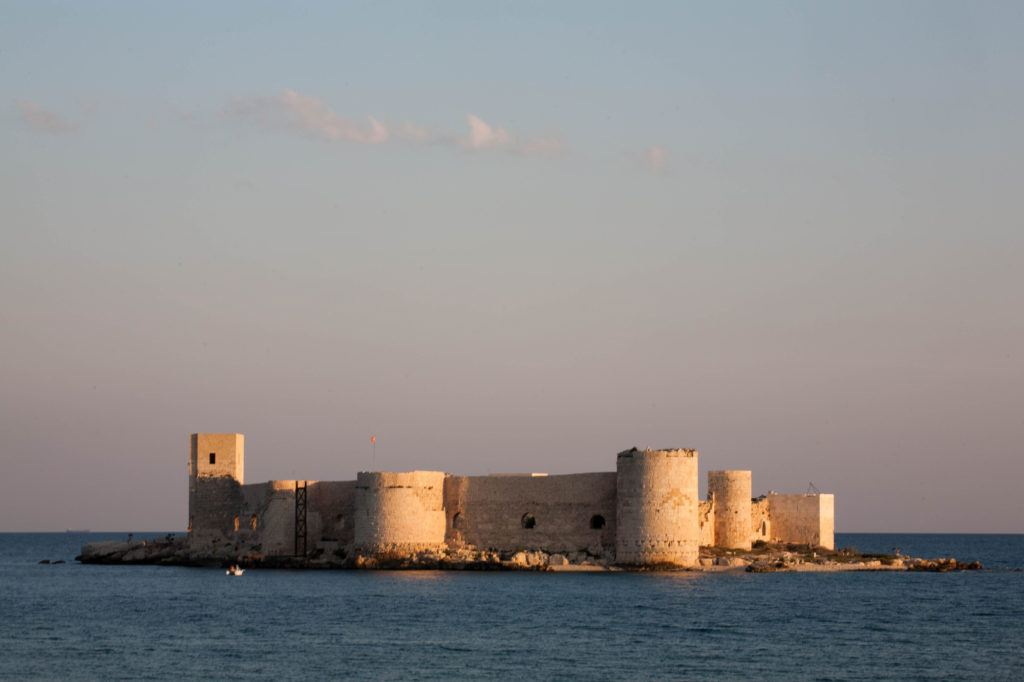 The sun sets on the Maiden Castle, right off the shore of Kizkalesi.