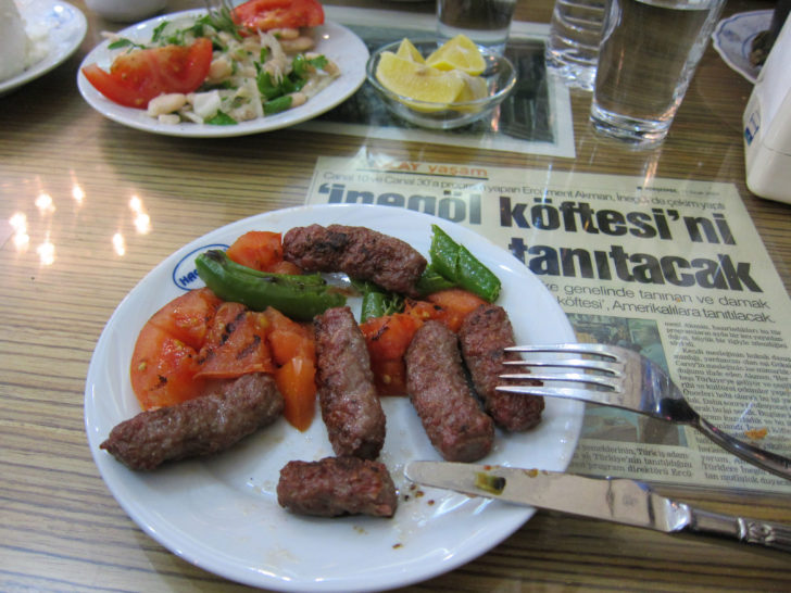 Turkish Food Recipe - Köfte sizzling in the pan.