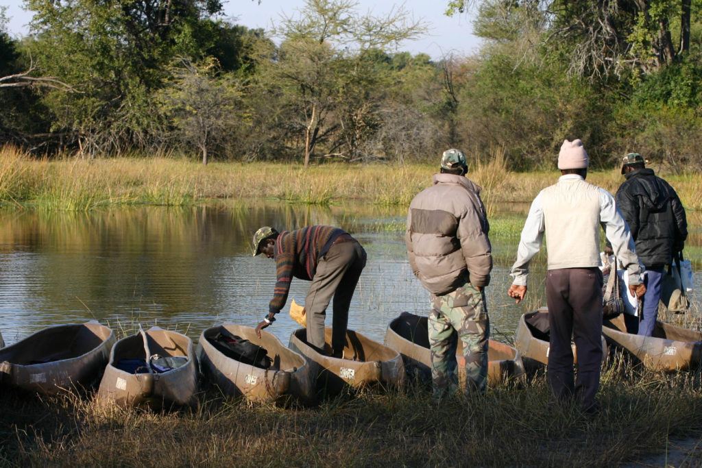 Guides prepare the traditional dugout-like boats, for our Mokoro safari.