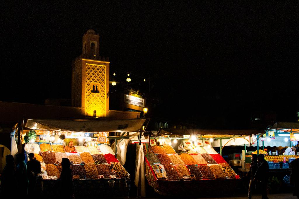 Spices and Minaret lit up in the Marrakech Medina.