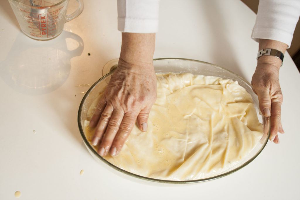 Layered borek with egg wash on top is ready for the oven.