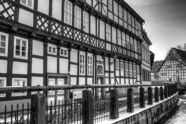 Half-timbered houses line the river.