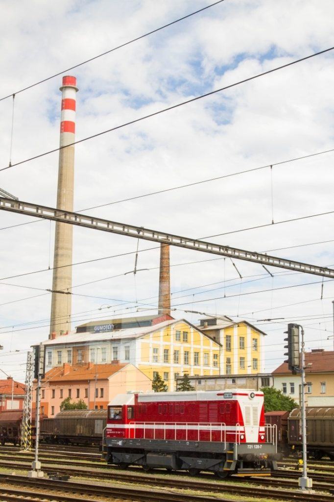 Red train car in a rail yard in Eastern Europe