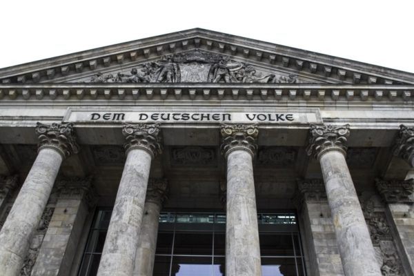 The columns and cravings at the entrance to the. Reichstag in Berlin.