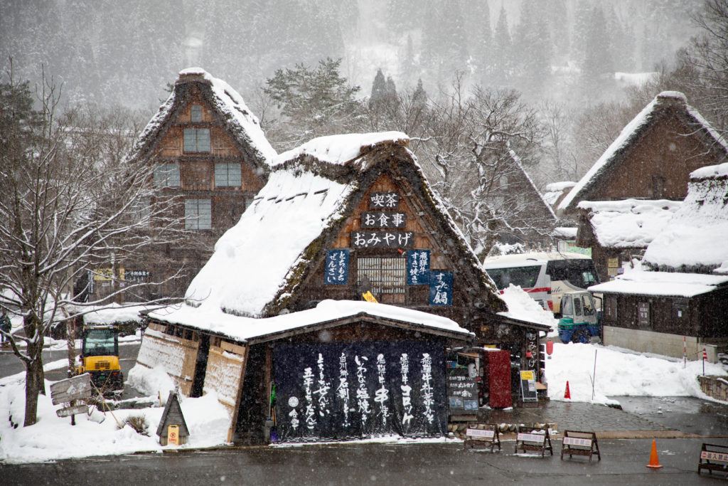Restaurants and shops in the bus and car parking lot for Ogimachi.