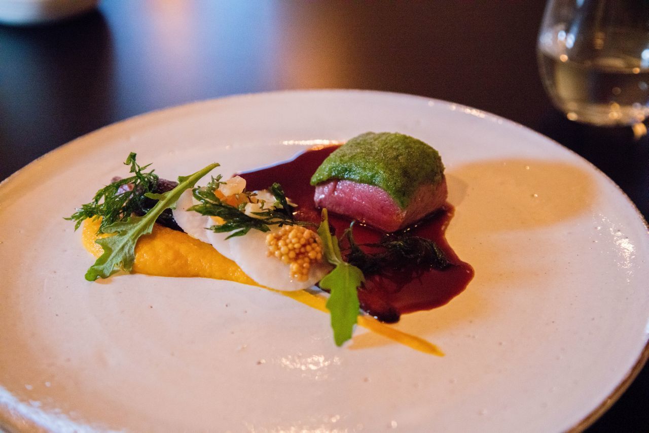 An exquisite plate of succulent lamb with sauce and puree. 