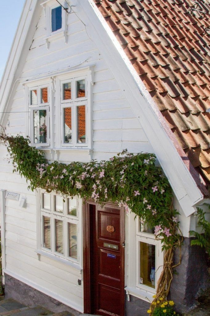 White house with flower garland.