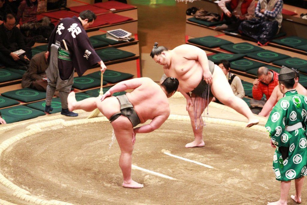 Competitors completing the ritual before the Sumo match begins.