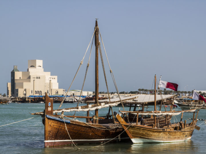 Traditional dhows wait for passengers at Doha Bay. Taking a dhow is a must-do in Qatar.