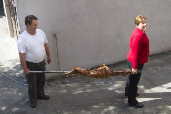 Bringing in the freshly roast lamb, still on the spit.