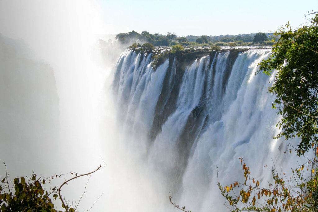 Tons of water from the Zambezi River goes over Victoria Falls and the spray gets everyone wet.