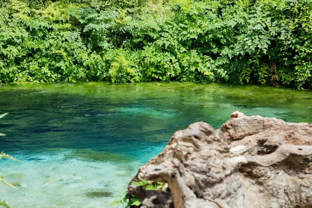 The gorgeous blue water of the Blue Eye in Albania - must-see part of any Albania road trip itinerary. 