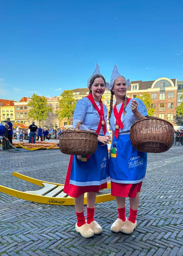Dutch girls selling cheese.