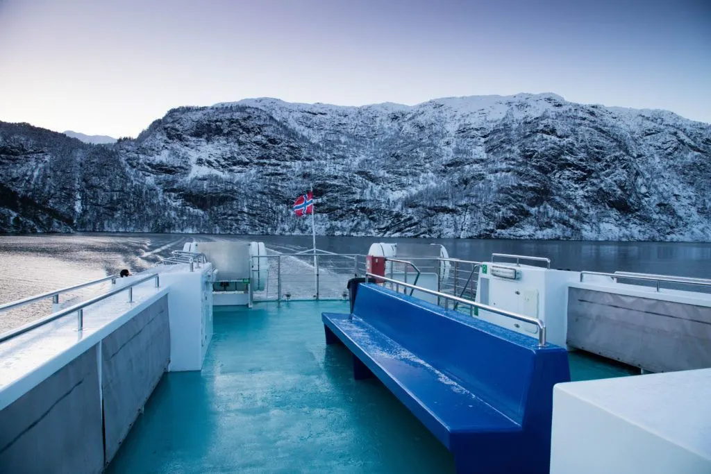 A boat on a fjords tour has the best views in Norway in winter.