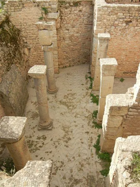 Most of the Roman villas in Bulla Regia have been buried, so you look down to see them.