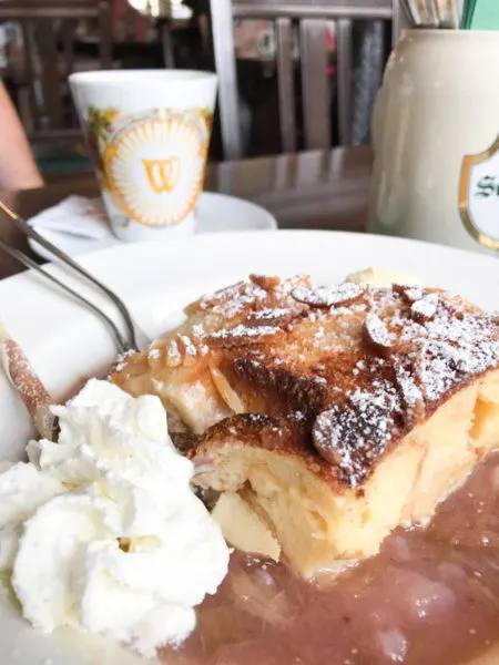 Not sure what to eat in Germany? Try a German dessert of bread pudding and whipped cream.