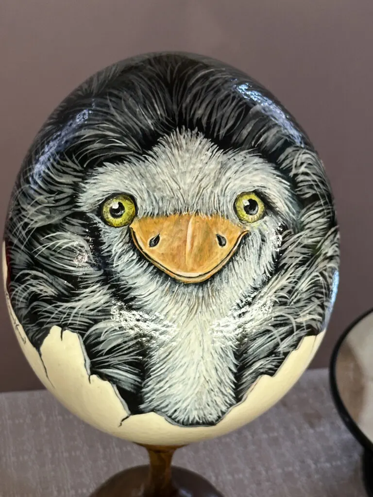 An ostrich painted on an eggshell.