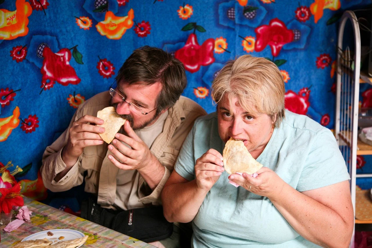 Jim and I trying the khuushuur. It was hot, but delicious. I thought I was going to burn. myself, that's why the look.