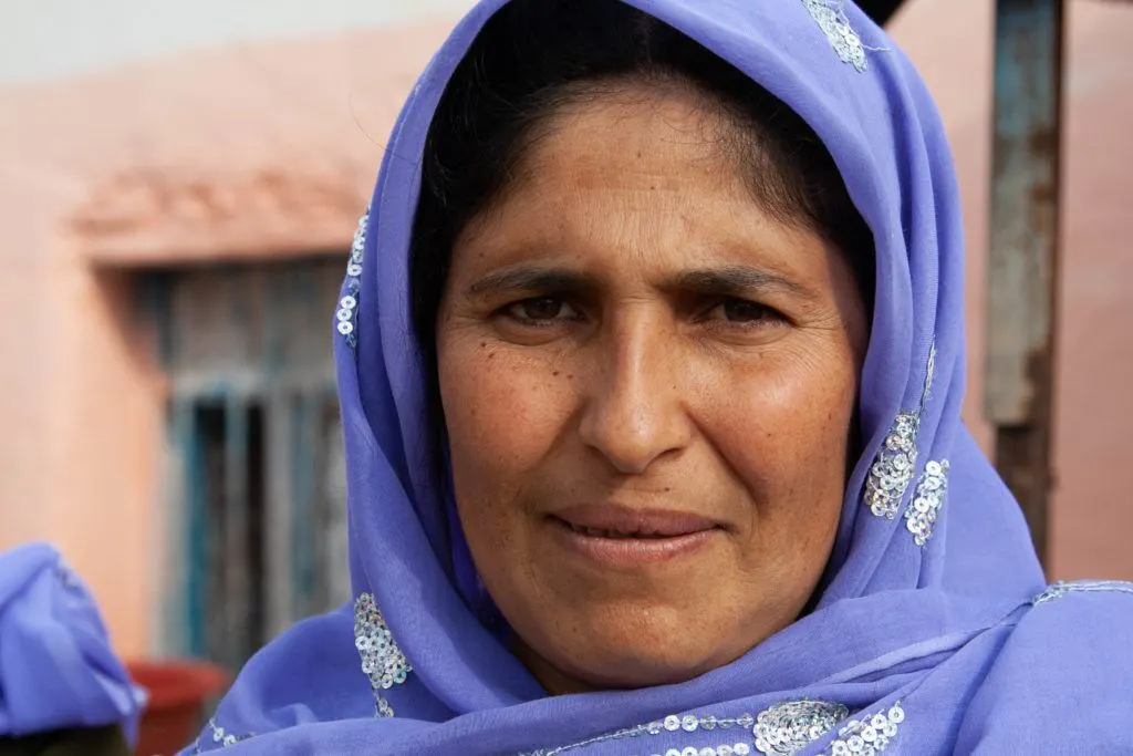 Woman with purple scarf.