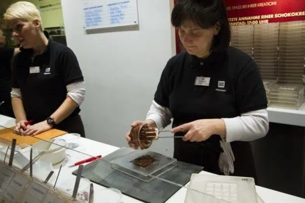 Vigorously stirring the Ritter Sport Chocolate in Berlin. 