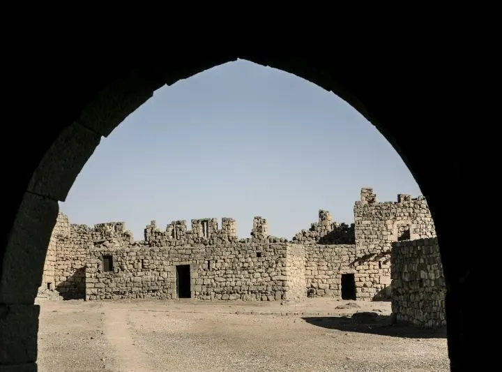 A peek through an arch of one of many castles in Jordan.