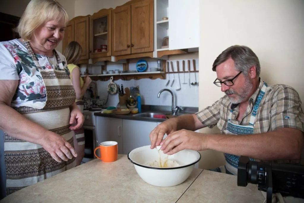 Cooking lessons - Jim cracks an egg.