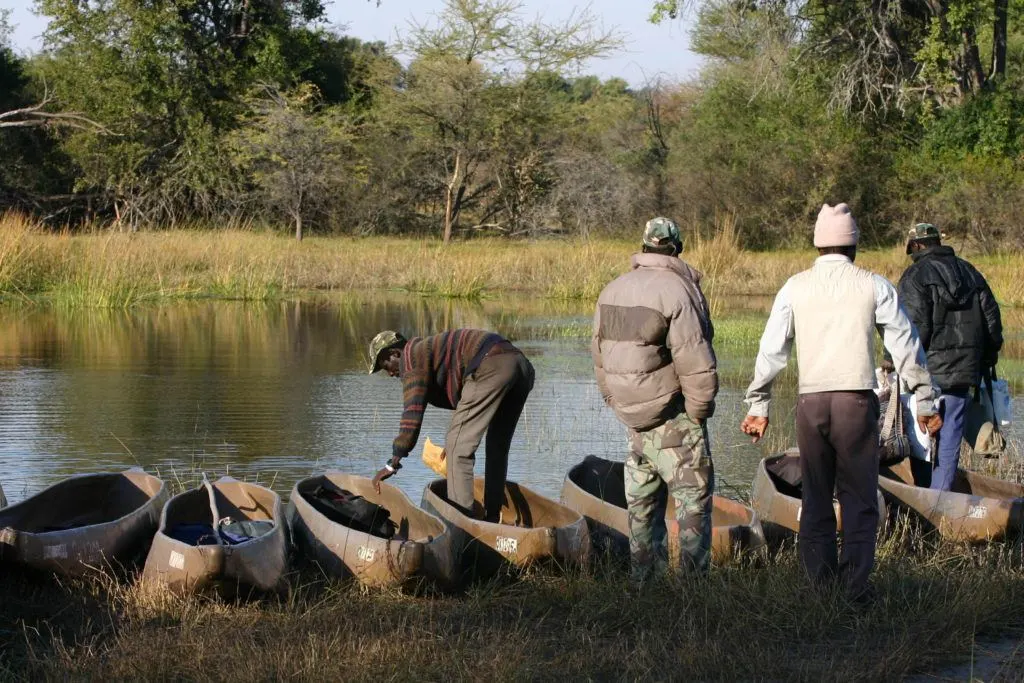 Guides prepare the traditional dugout-like boats, for our Mokoro safari.