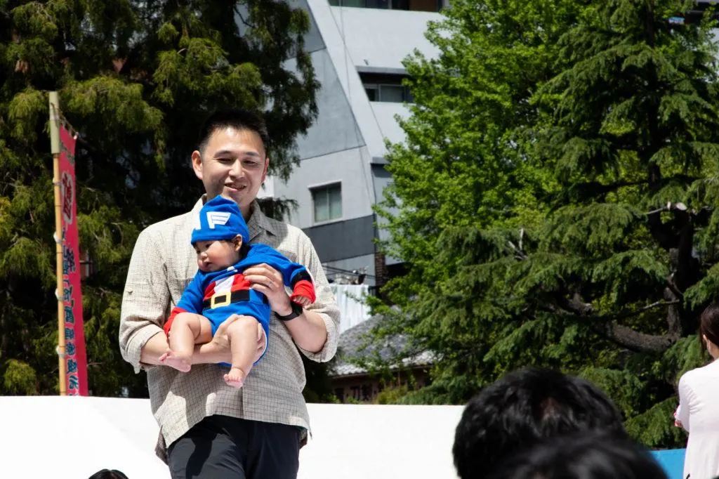Proud father with baby before the sumo cry fest begins.