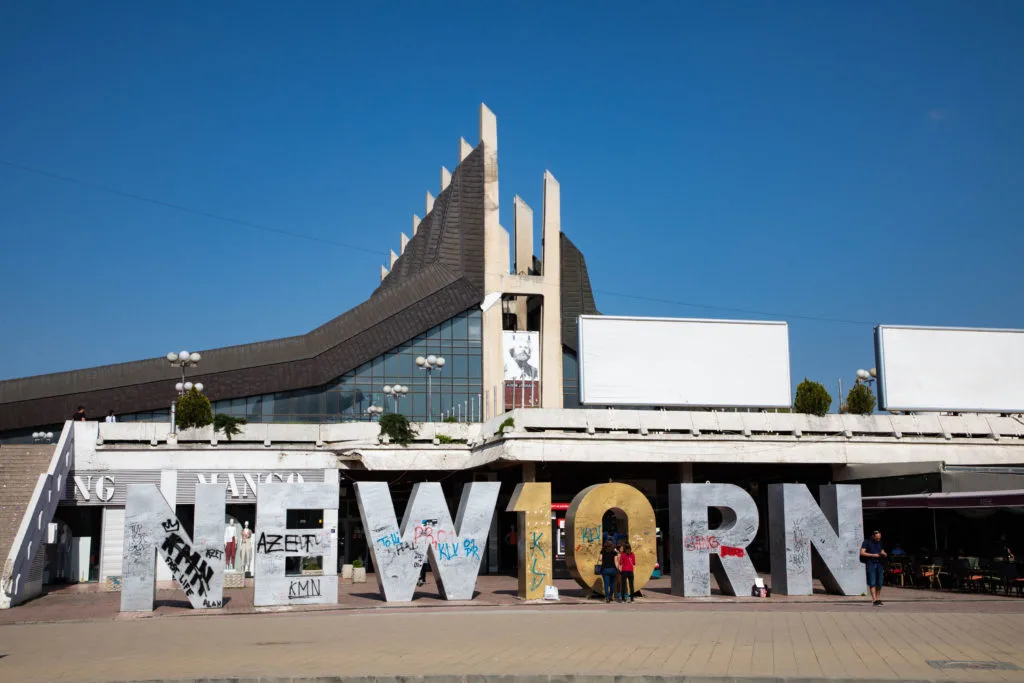 The famous and much graffitied Newborn statue in Pristina, Kosovo.