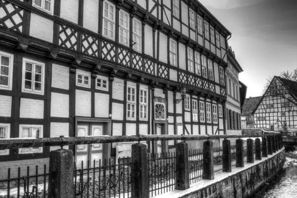 Half-timbered houses line the river.