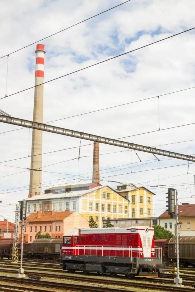 Red train car in a rail yard in Eastern Europe