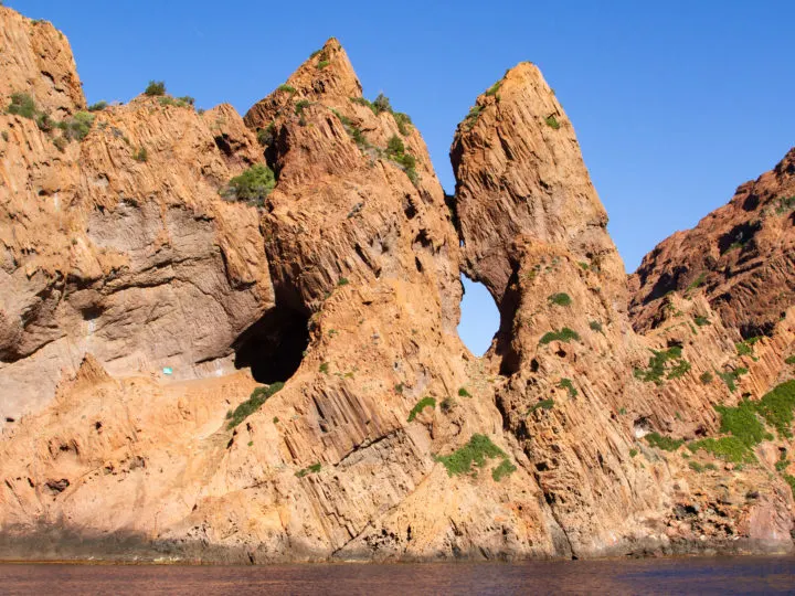 Stunning holes peek through the cliffs in the Scandola Nature Reserve.