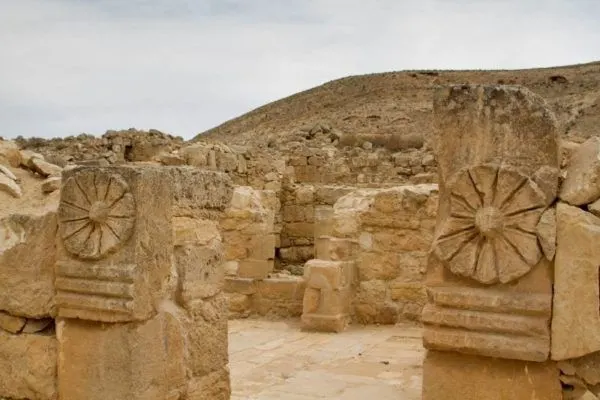 Remains of ancient carved pillars in ruins in the Negev.