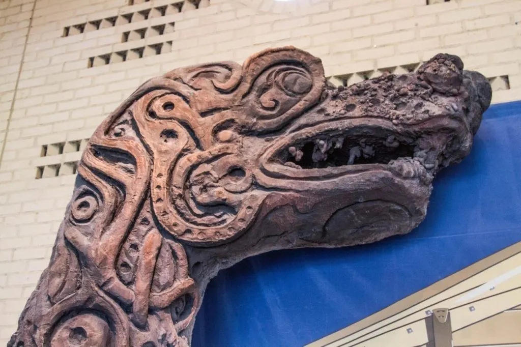 Animal wood carving with designs from ancient viking ship.