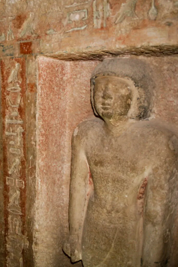 Visiting the Valley of the Kings is one of the most important places to visit in Egypt. A relief statue inside King Tut's tomb.