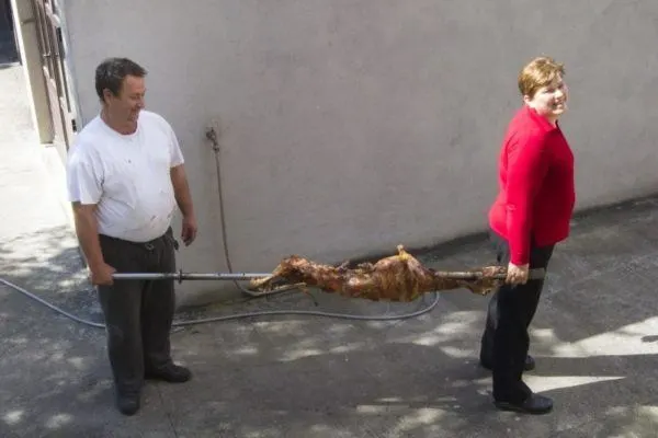 Bringing in the freshly roast lamb, still on the spit.